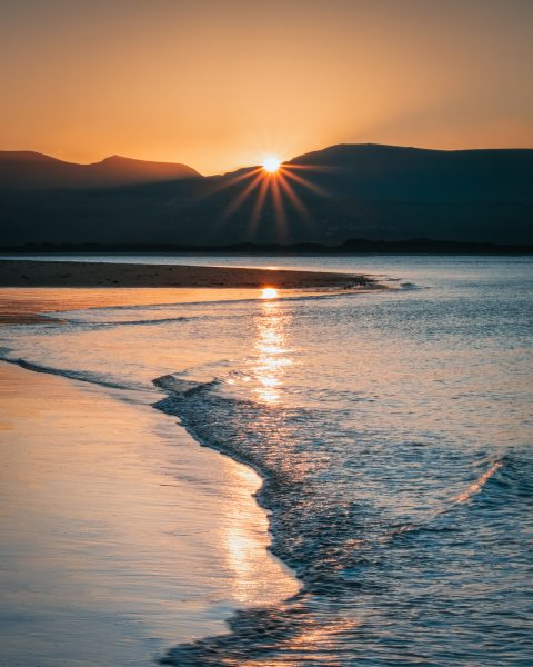 Sunrise over Nantlle from Llanddwyn, Anglesey